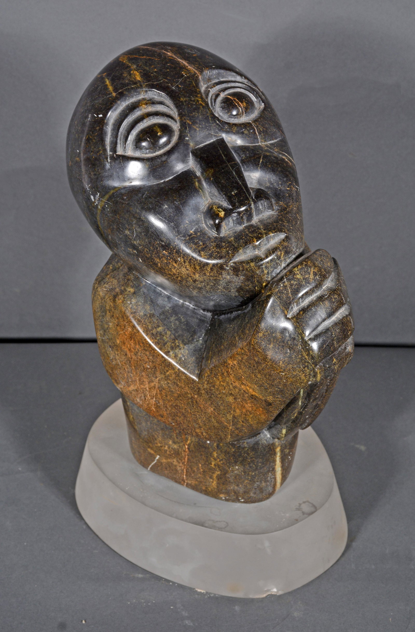 Ewinig Nyriro. The Thinker.: Ewinig Nyriro. The Thinker. Signed. Carved and polished stone. Excellent condition. 14.5" h x 7" x 6" with stand. Est. $200-300. Ship: $100