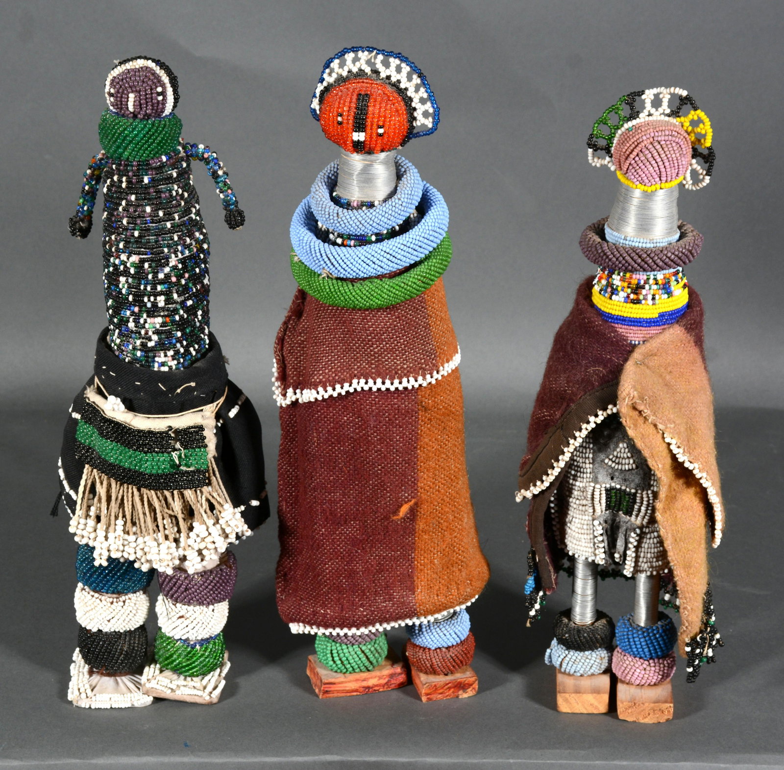 African Beaded Dolls.: African Beaded Dolls. Not signed. Beads and mixed media. Great condition. Average size is 14" h. Est. $25-50. Ship: $25