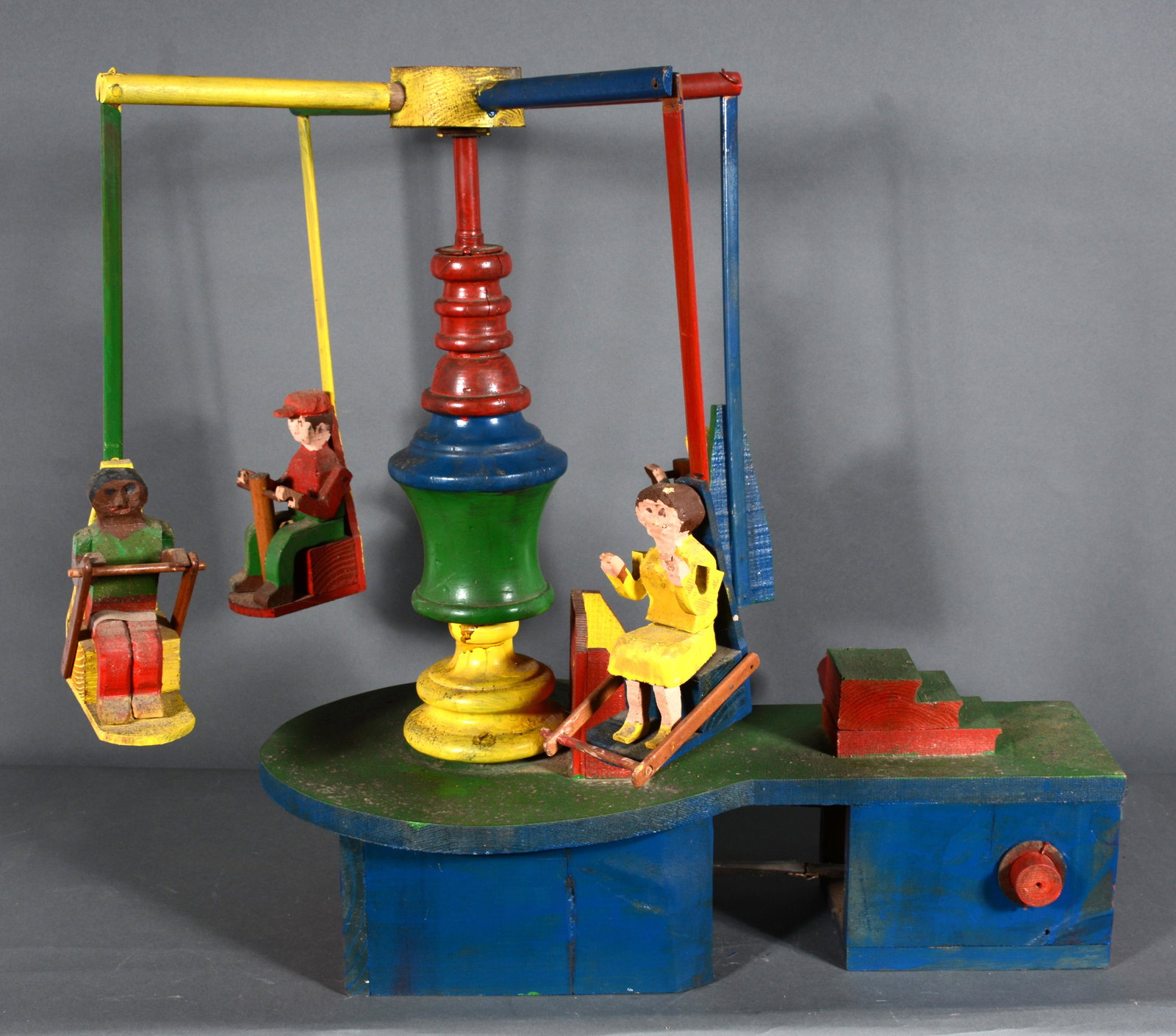 Hand Crank Wooden Toy.: Hand Crank Wooden Toy. Not signed. Carved and painted wood. Good condition. 24" h x 21" x 29". Est. $100-200. Buyer is responsible for shipping.