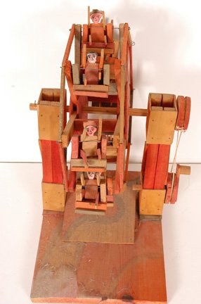 Ferris Wheel Crank Toy.: Unknown maker. Wood, wire, string and paint. 10" x 14" x 17". Hand cranked. Possibly a child's toy. This piece is probably from Oaxaca, Mexico. It uses "old paint" rather than the new very bright colo