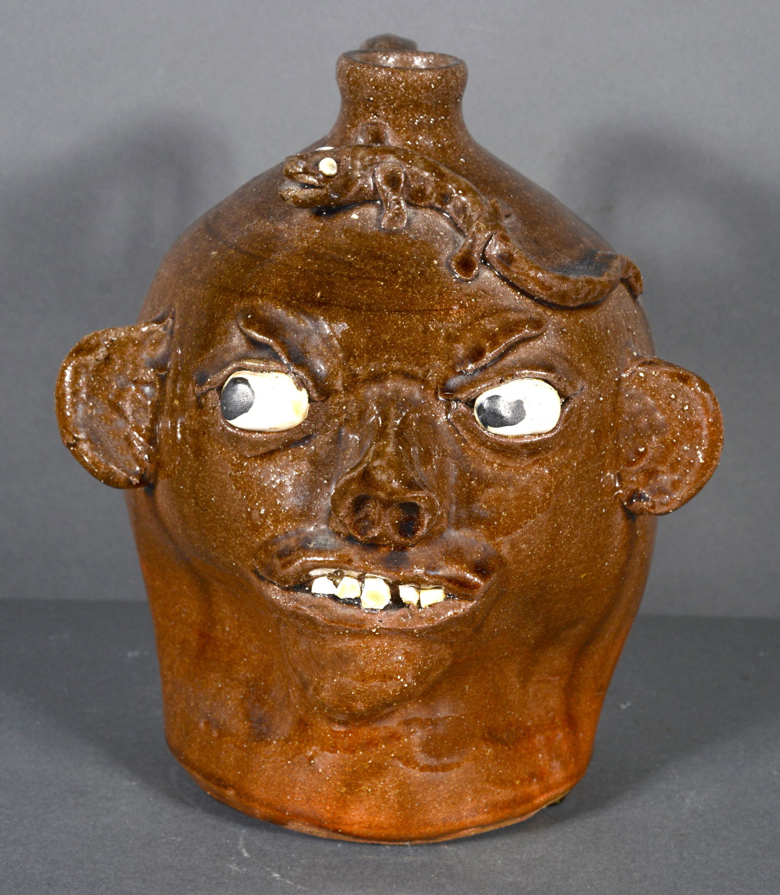 Chester Hewell. Traditional Glaze Face Jug with Lizard. (1 of 5)