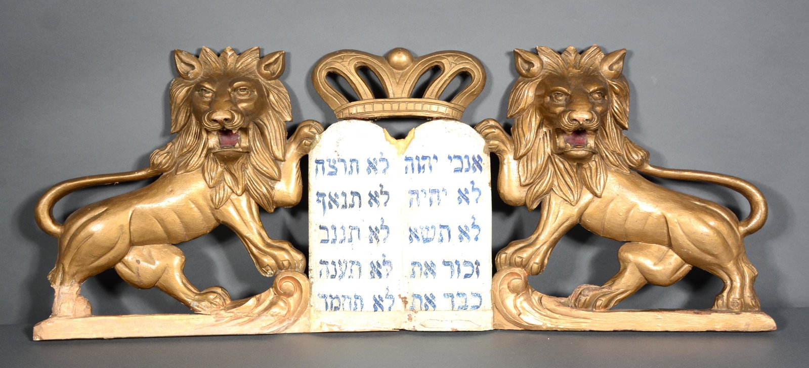 Lion of Judah Torah Ark Top.: Lion of Judah Torah Ark Top. c. 1900-30s. Not signed. Carved and painted wood. Loss and repairs to lower left base and top of 10 commandments, otherwise good condition. 36.5" long x 14.5"h x 4"d. Est.