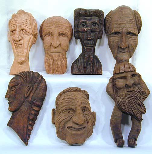 Clarence Stringfield 7 Faces: Carved wood. Average size is 6" w x 12" h. Provenance: The Florida Folk Art Museum.
