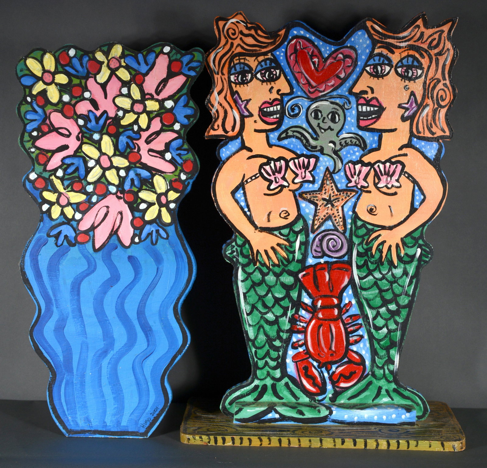 Hugo Porcaro. Mermaids & Flowers.: Hugo Porcaro. Mermaids and Flowers. 2001. Signed and dated. Pair of works. Paint on cut out board. Great condition. Largest is 34" x 11" x 20" h. Proceeds to benefit The Paradise Garden Foundation. Es