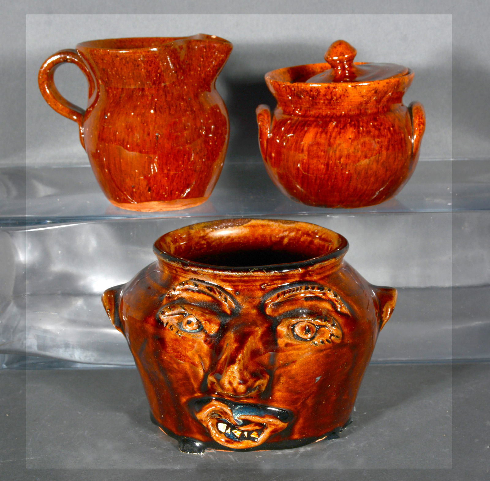 Brown & Jugtown Pottery. Face Jug, Sugar Bowl, Creamer. (1 of 2)