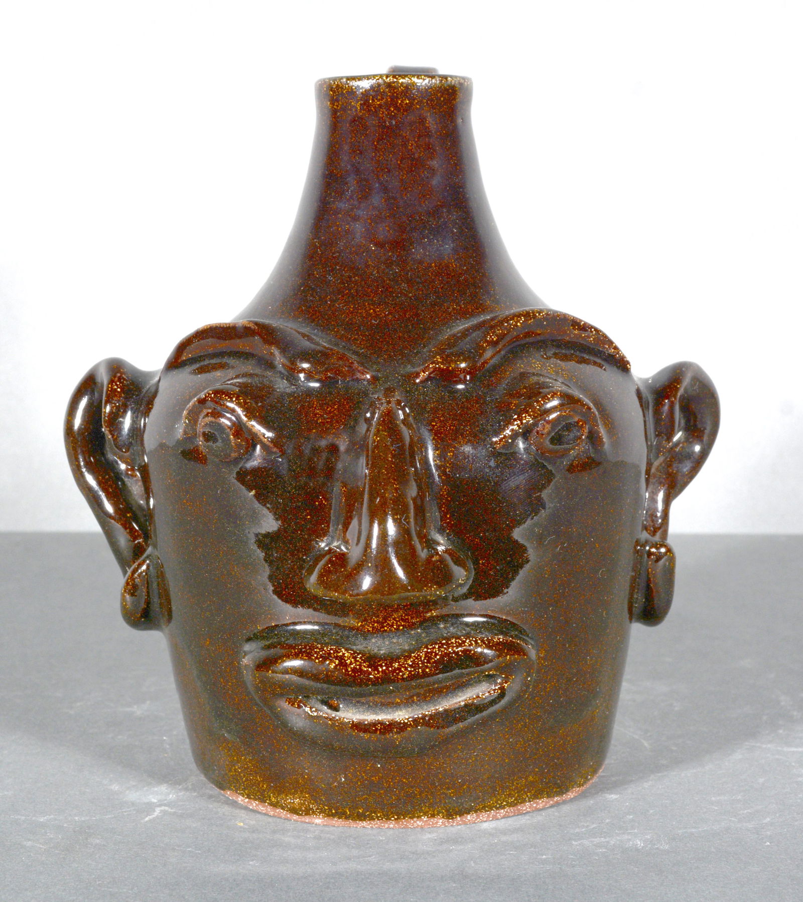 Joan Arnold. Black Glazed Face Jug. (1 of 4)