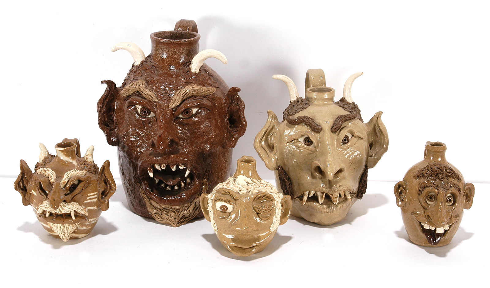 N. Cole Family Pottery. 5 Face & Devil Jugs. (1 of 2)