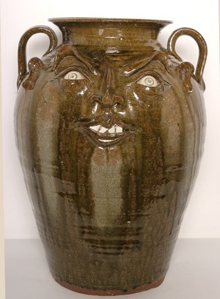 Kim Ellington. Extra Large Face Churn.: Extra Large Face Churn.Alkaline glaze. Signed in script, "GKE Vale, NC" under handle. Beautiful glaze drips. Great hand-dug clay with visable quartz. 18" h x 13"diameter. Mint condition. Est. $400-600