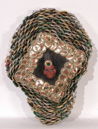 Mr. Imagination Bottlecap Frame w Bust.: Bottlecap Frame with Paint Brush Bust.Jewelled paint brush, bottlecaps, paint, wire, backed on board. Signed and dated, 1995. 12" w x 18" h. Est. $300-500. Ship: $45