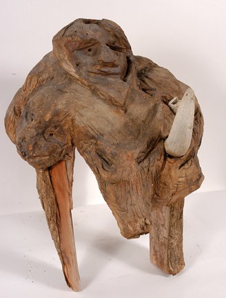 Jesse Aaron. Multi-Figure Creature.: Multi-Figure Creature.Burl-carved wood with attached legs and horns. 24" x 22" x 18". One horn broken off. Est. $300-500. Ship: $85
