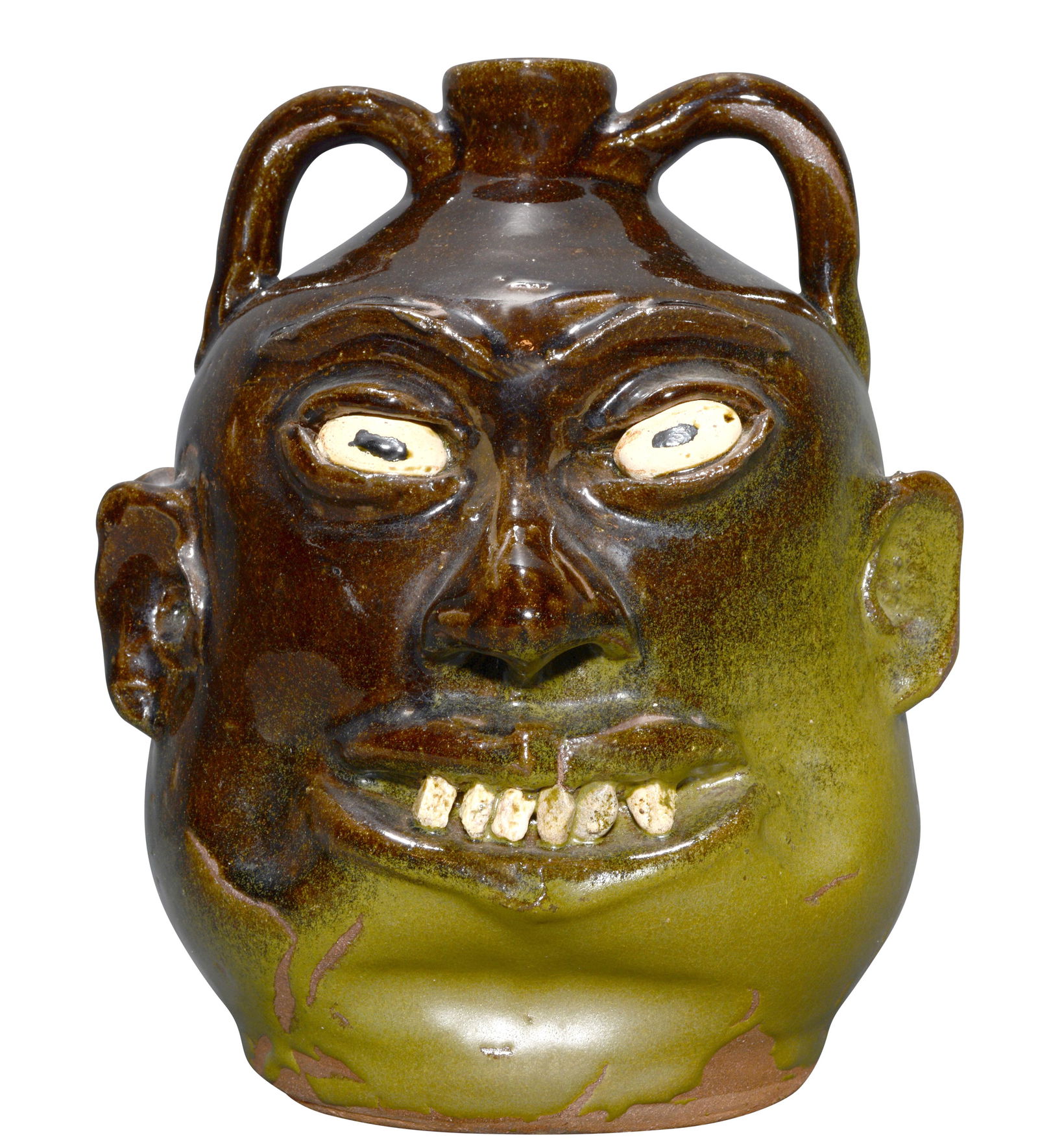 Lanier Meaders. Double-Face Rock Tooth Face Jug.: Lanier Meaders. Double-Face Rock Tooth Face Jug. c. 1960s. Two-tone high and matte glaze. Minor glaze crawl, otherwise mint condition. 9.5"h. Est. $2,000-4,000. Ship: $65