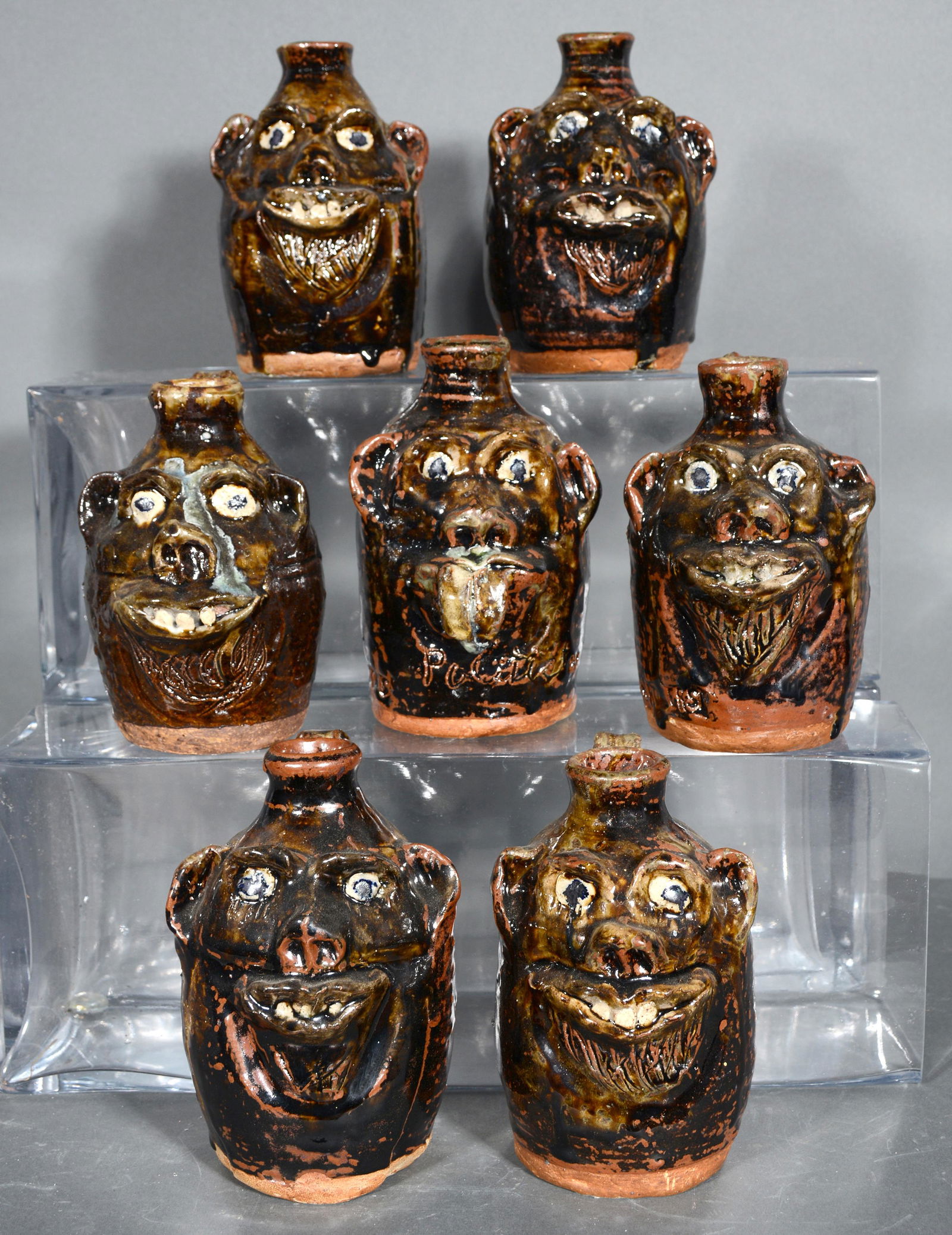 Marie Rogers. Seven Pint Size Face Jugs. (1 of 2)