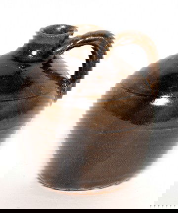 Lanier Meaders Miniature Whiskey Jug.: c. late 1960's. Signed. Very early piece. Base has original wheel marks. Ash glaze. Mint condition. 5"h. Est. $200-300. Ship: $25