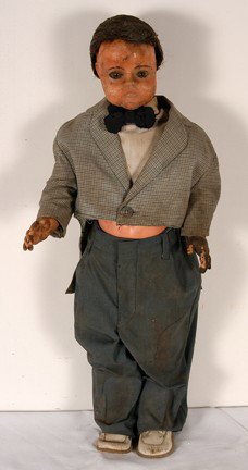 Tiny Tim Wax Figure.: Sculpted wax figure, hair piece, turn of the c. costume. Dolls body, 29" h. Very good condition. Est. $300-500. Ship: $65