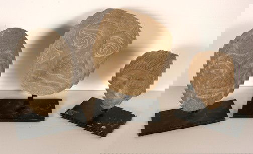 David Marshall 3 Carved Stone Round Faces.: Carved stone on metal display stands. Excellent condition. Average size is 5" x 4". Est. $200-400. Ship: $45