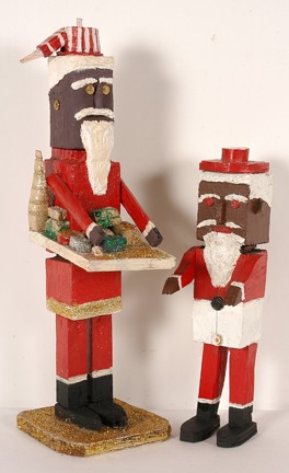 Rev. J.L. Hunter Black Santas.: Pair of carvings. Carved and painted wood, glitter and buttons. Signed. Excellent condition. 9" x 9" x 26". Provenance: Dr. Regenia Perry. Est. Est. $200-400. Ship: $65