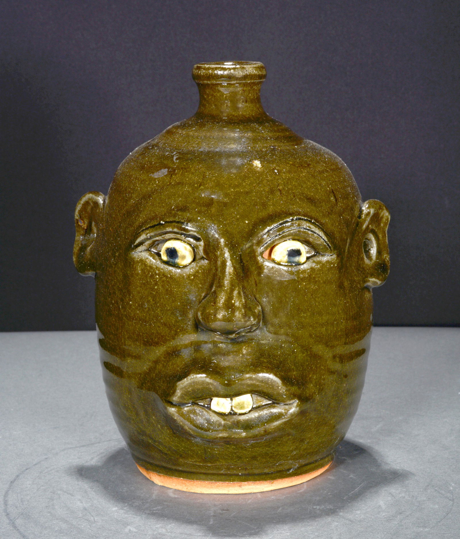 Anita Meaders. Dark Green Face Jug. (1 of 4)
