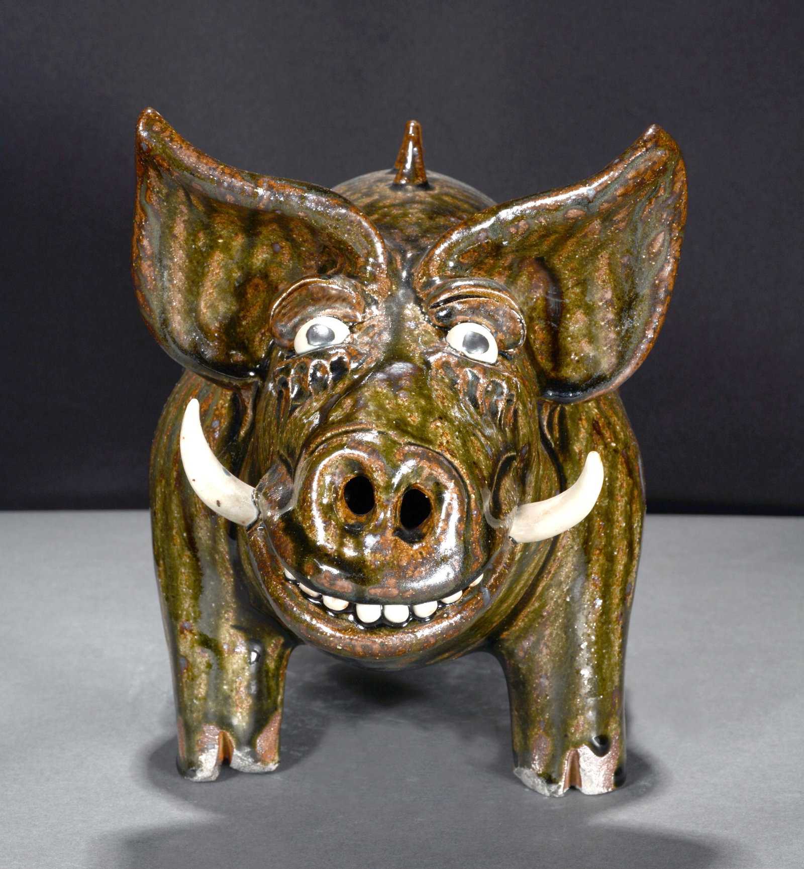 Clete Meaders, Jr. Spiney Back Pottery Hog.: Clete Meaders, Jr. White Tusk Spiney Back Pottery Hog. Signed. Mint condition. 9"h x 14" long. Est. $200-300. Ship: $85