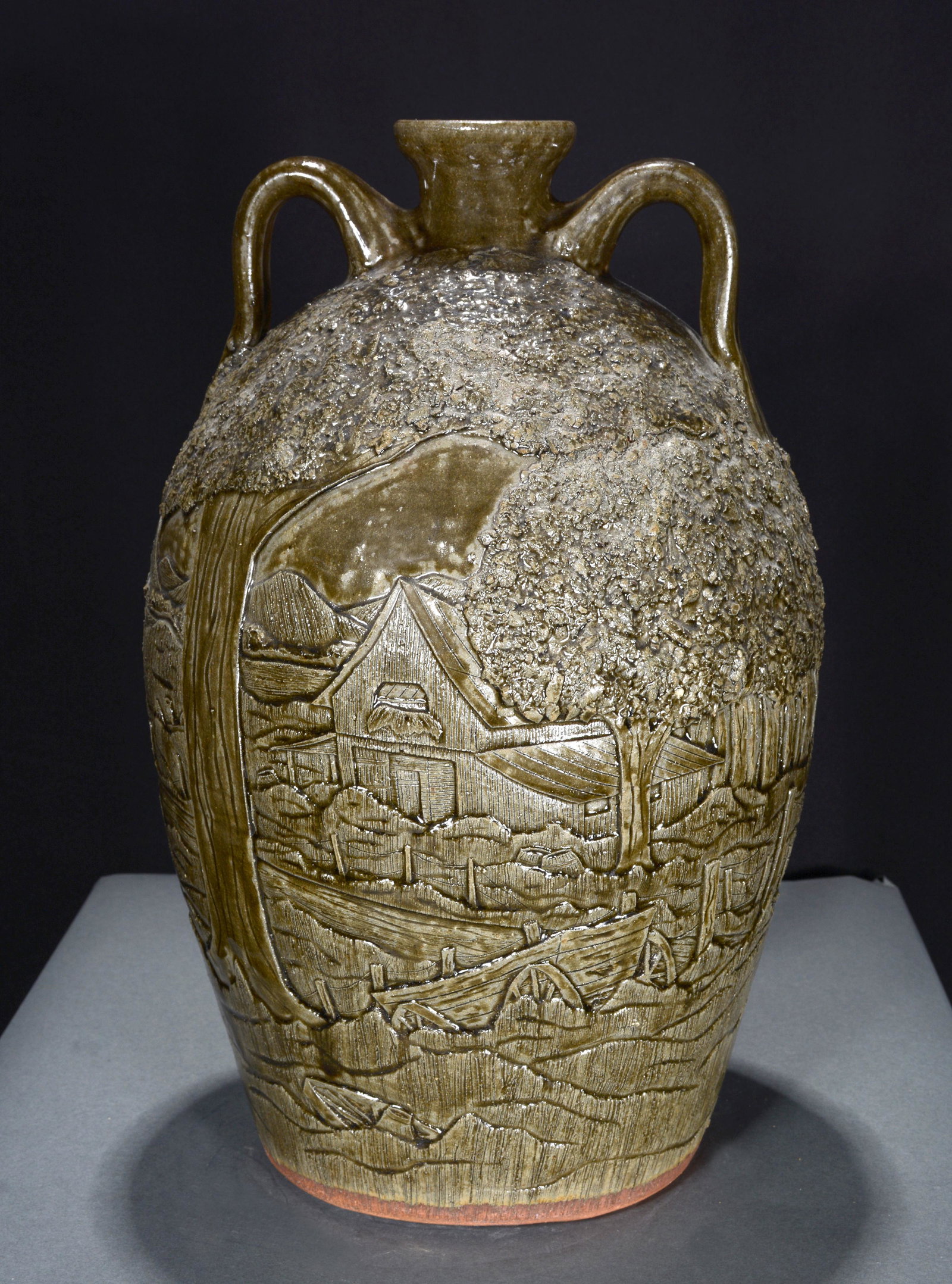 M. & M. Crocker. 4 Gallon Jug with Incised Farm Scene.: Michael and Melvin Crocker. Four Gallon Jug with Incised Rural Farm Scene. Signed by both. Very detailed. Mint condition. 16.5"h. Est. $200-300. Ship: $85