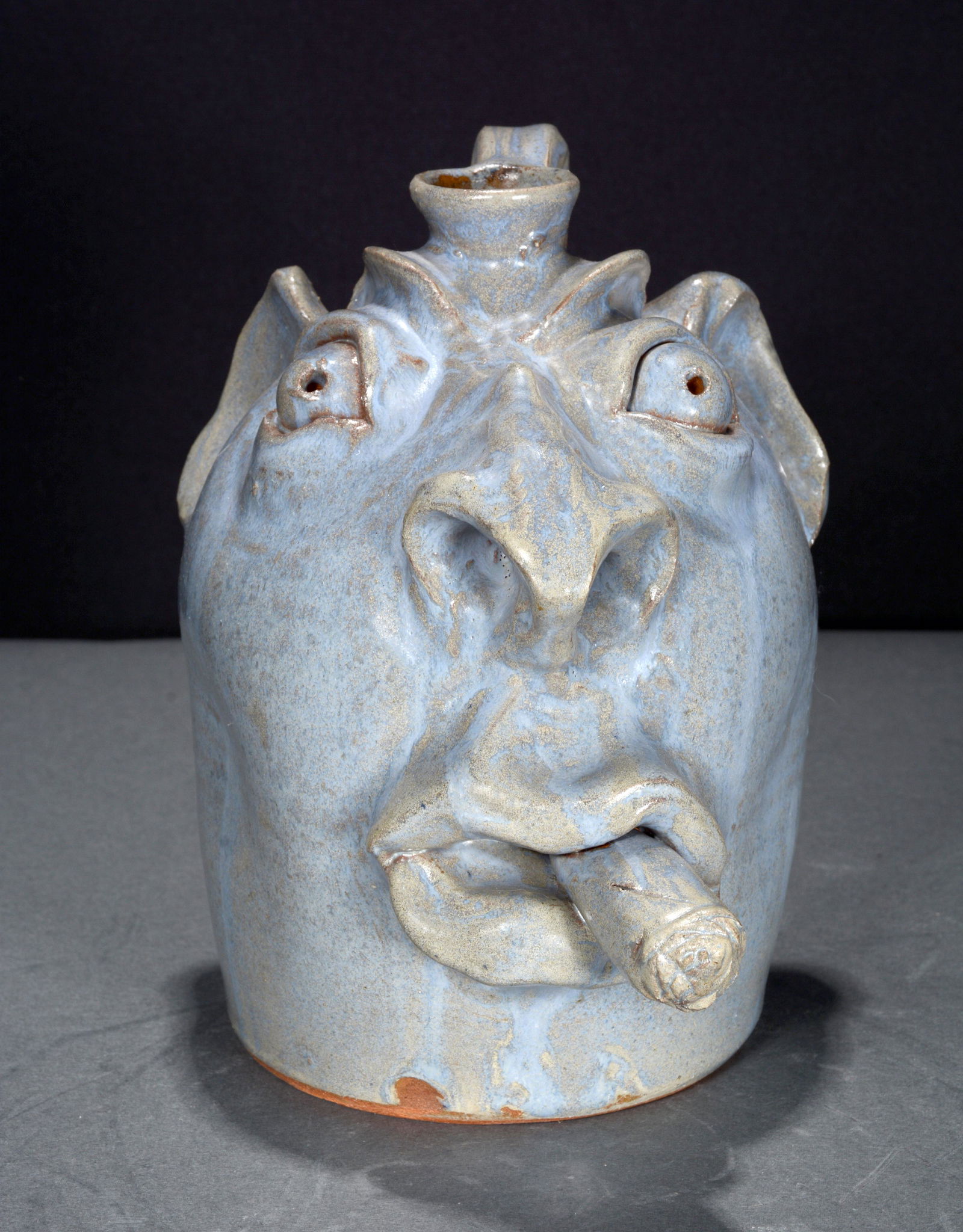 Brown Pottery. Blue Face Jug With Cigar. (1 of 4)