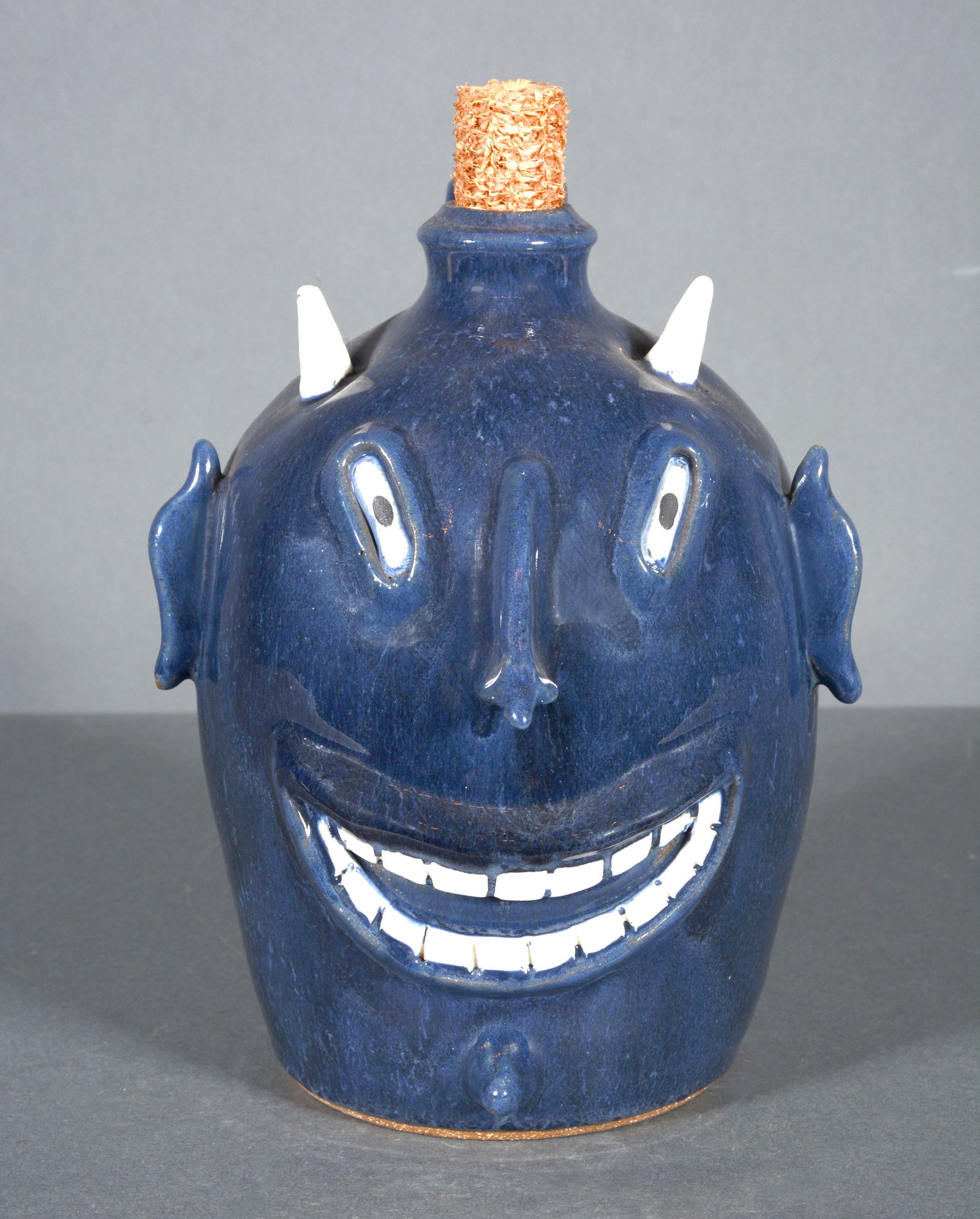 Sid Luck. Grinning Blue Devil Face Jug. (1 of 4)