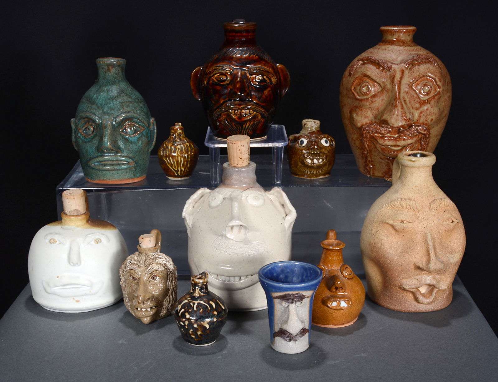 12 Pint Size and Mini Face Jugs. (1 of 2)