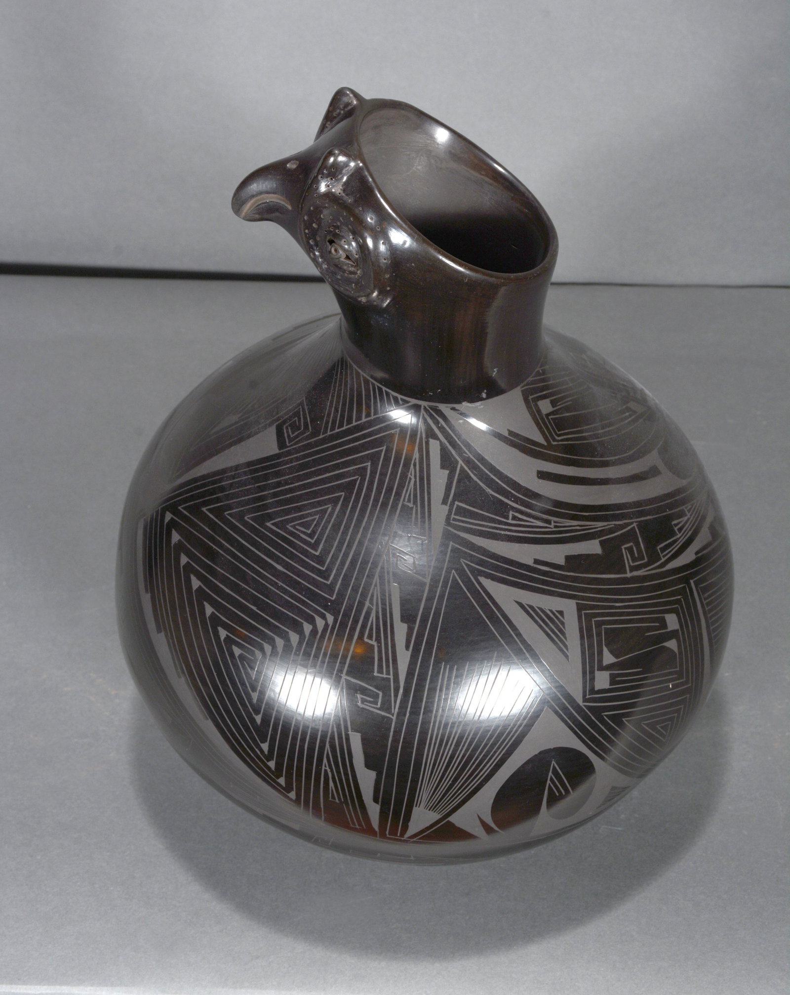 Reynalda Quezada. Animal Morphis Quail Pot.: Reynalda Quezada. Animal Morphis Quail Pot. Signed. Stone polished highly detailed black pot. Mint condition. 11.5" h x 9" diameter. Est. $800-1,200. Ship: $55