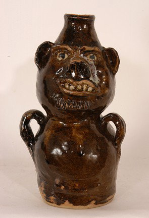 Marie Rogers Brown Totem Face Jug.: Brown Totem Face Jug. 9" h. Mint condition. Est. $200-300. Ship: $35