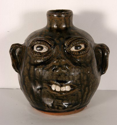 Cleater & Billie Meaders Small Face Jug.: Small Face Jug. Beautiful tobacco-spit glaze. signed and dated, 1990. 6"h. Excellent condition. Est. $100-200. Ship: $30