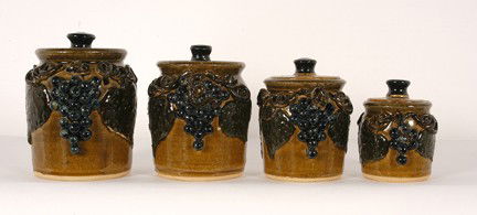 Lanier Meaders Grape Decorated Cannister Set.: Grape Cannister Set (4 pieces). 1978. 8.25"h, 7.5" h, 6.5" h, 5.5" h. According to Michael Crocker, noted expert in Meaders' Pottery, "This multi-grape canister set was made in 1978, a year Lanier mad