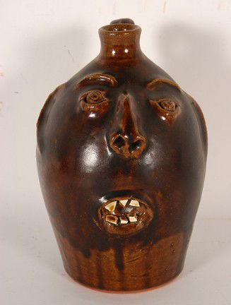 Robert Brown Browns Pottery Face Jug.: Face Jug with China Plate Teeth. Signed. 9"h. Mint condition. Est. $200-300. Ship: $35