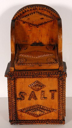 Tramp Art Salt Box.: Salt Box. Carved wood. Illustrated in Another Notch, page 8. Excellent condition. 11.5" h x 4" d. Est. $150-250. Provenance: Clifford Wallach. Ship: $30