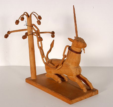 Edgar Tolson Unicorn.: Unicorn Chained To An Apple Tree. Carved wood, leather collar. One of the apples looks to have an early repair, possibly even made the artist, otherwise excellent condition. 14h x 16"long x 10"w. Sign