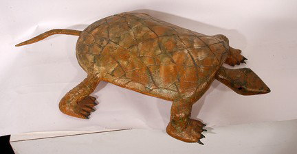 Isaac Smith Desert Storm Turtle.: Carved wood and paint. Signed and dated, 1991. Legs appear to have been repaired. 30"long x 15"w. Est. $100-200. Ship: $65