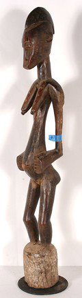 Senufo Tribe Rhythm Pounder.: Carved wood. 47" h. Some wear and wood loss on arms. Est. $200-300. Ship: $100