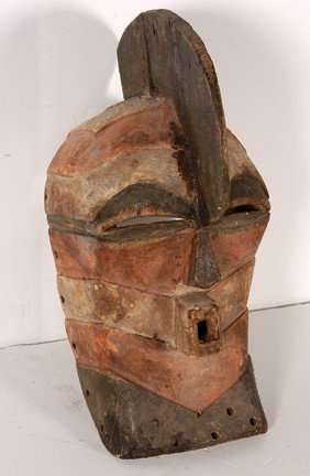 Sonye Tribe Ritual Mask.: Shows many signs of ritual use and wear. Sweat markings on the interior, a few native repairs on the crest and chin. Repair to crown. 17" h. Est. $100-200. Ship: $45
