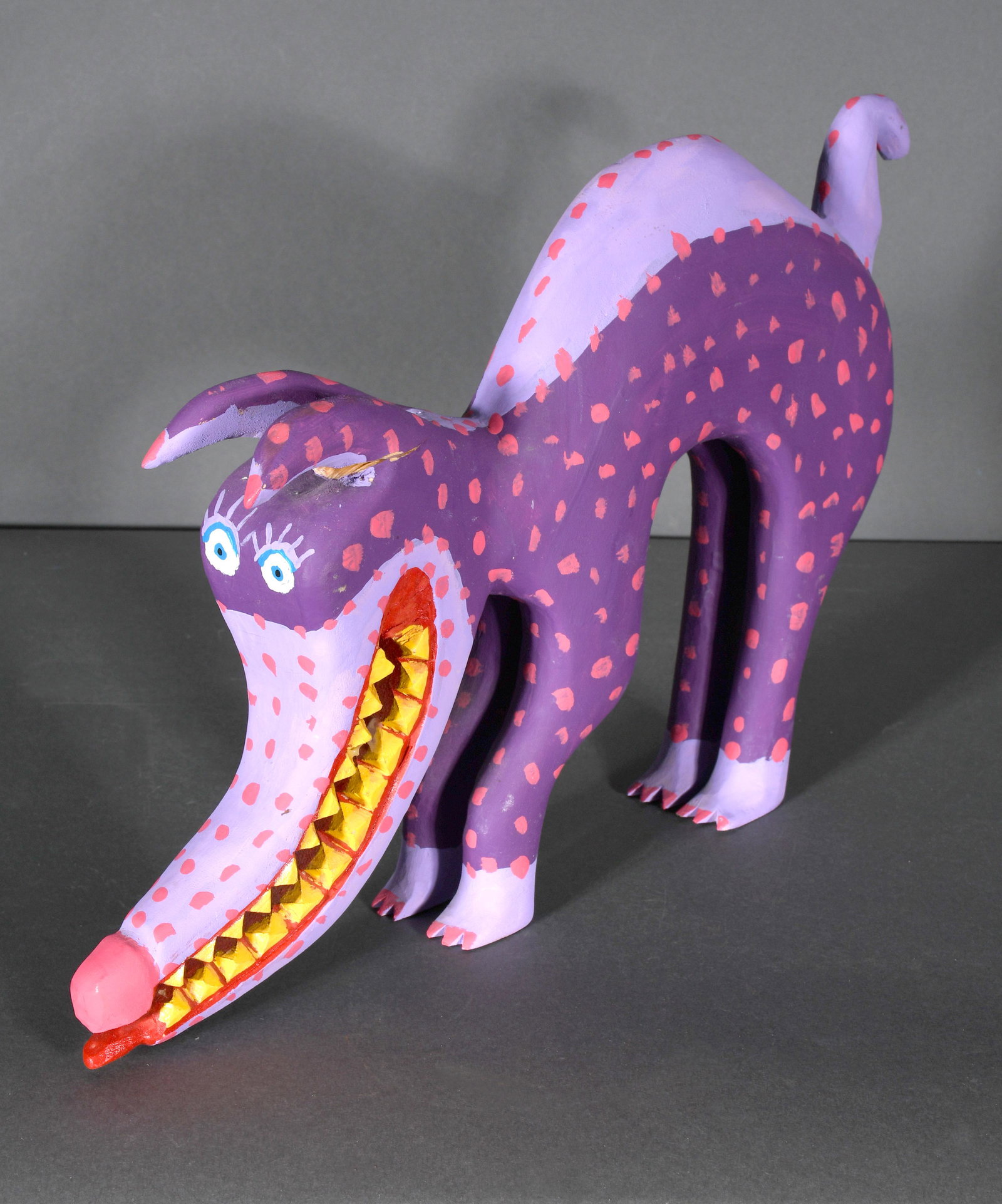 Minnie Adkins. Purple Anteater.: Minnie Adkins. Purple Anteater. 2002. Signed and dated. Carved and painted wood. Repair to ear, otherwise good to fair condition. 12.5" x 9"h x 1.5"w. Est. $100-200. Ship: $55