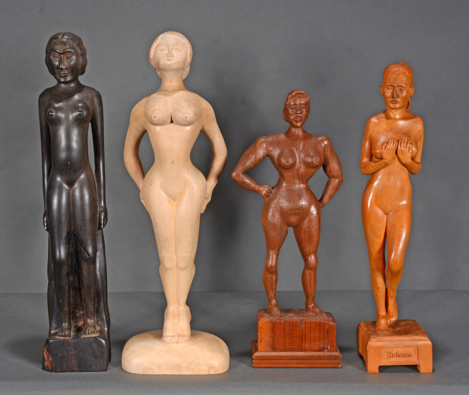 Four Carved Nude Women.: Anonymous. Four Carved Nude Women. c. 1930-2000. Not signed or dated. Carved iron wood, oak and pine. Ironwood has major crack, otherwise 3 in excellent condition. Largest is 18.5" x 16". Est. $100-20