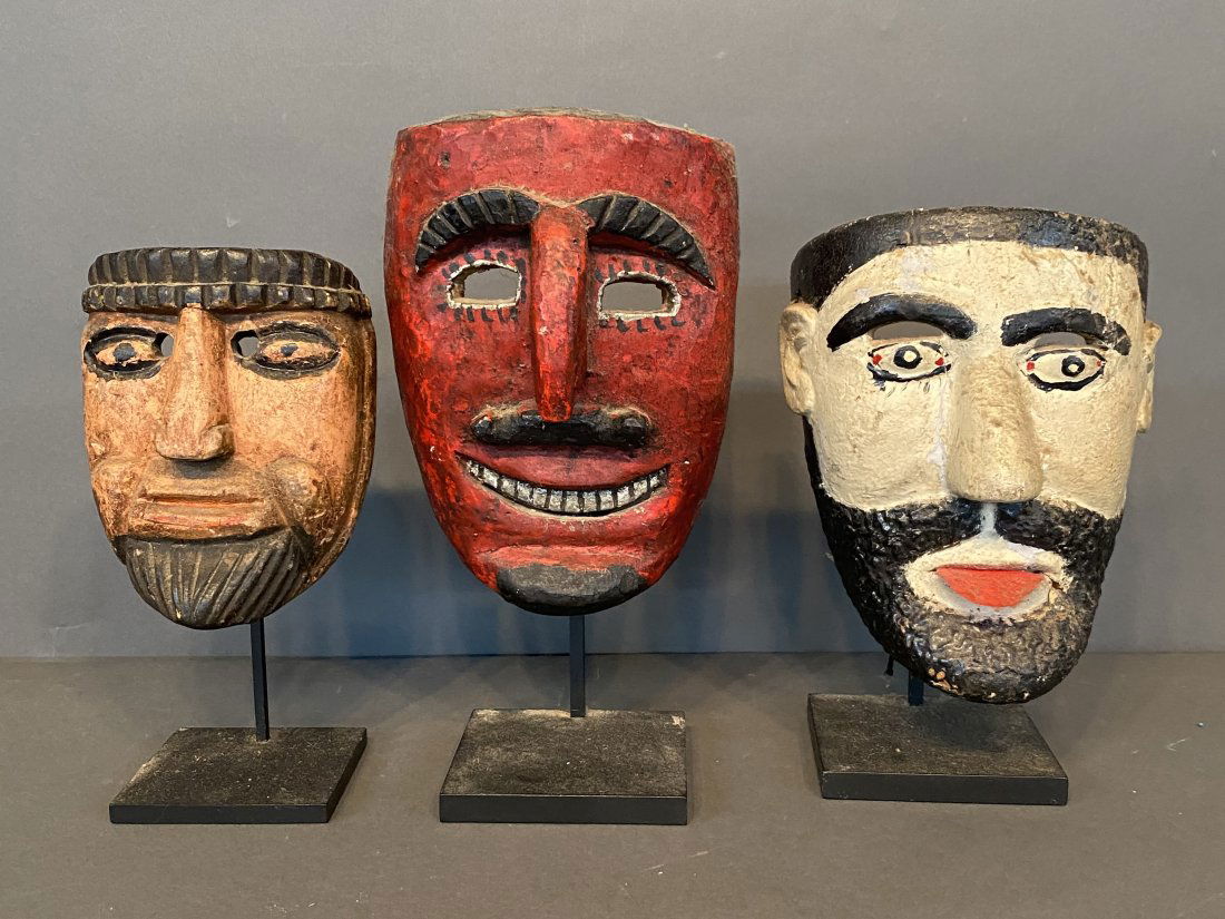 Three Hispanic Masks On Display Stands. (1 of 5)