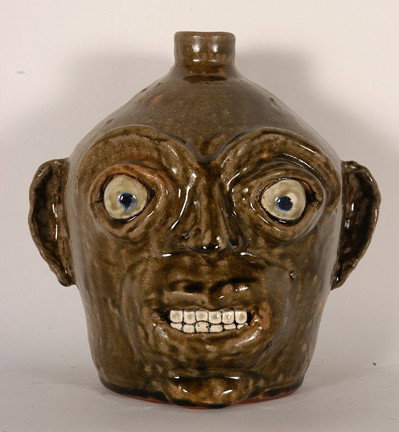 John Meaders. Pop-Eyed Face Jug, #69.: Tobacco-spit glaze. Signed and numbered. Dated with code. Mint condition. Rare piece. 8.5"h. Est. $2,000-3,000. Ship: $45