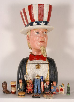 Constance Alyce Westvig Roberts. Uncle Sam.: 1998. Carved and painted wood with drop top chest panel with carved and painted mini-figures that represent part of American politics. They also second as whistles. Signed and dated. Excellent conditi