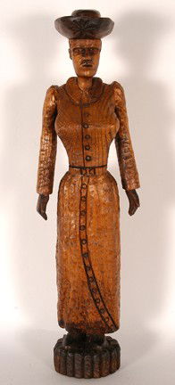 Clarence Stringfield. Refined Country Woman.: Carved and varnished wood. Signed. Excellent condition. A Stringfield Masterpiece. 7" x 4" x 24"h. Provenance: The George and Sue Viener Collection. Est. $1,000-2,000. Ship: $55