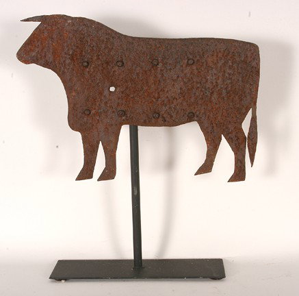 Bull Weathervane.: c. 1930-40's. Sheet metal riveted to frame. Well-rusted and pitted with one bullethole. 17" w x 20"h with base. Provenance: The George and Sue Viener Collection Est. $300-500. Ship: $45