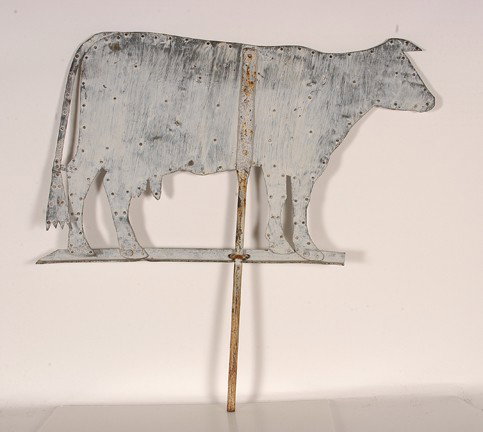 Dairy Cow Weathervane.: c. 1930's. Two pieces of sheet metal riveted together with milk paint and bullet hole. Original environmental condition. 33" w x 30"h. Provenance: The George and Sue Viener Collection, Ex. Gasperi Gal