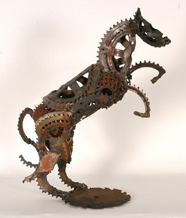 Gene Evans. Bike Sprocket Horse.: Welded metal bike parts. Not signed. Tail needs to be re-attached, otherwise great condition. 22" w x 14" x 8". Provenance: The Modern Primitive Gallery, GA. Est. $300-500. Ship: $75