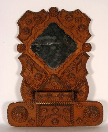 Tramp Art Hall Mirror w Mail Pouch.: Carved and stained wood, very early mirror. Wear on pocket, otherwise great condition. 21" x 26". Provenance: The George and Sue Viener Collection. Est. $300-500. Ship: $65