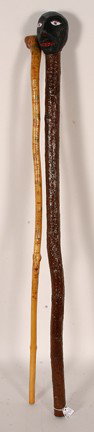 Thunder Boy & Unknown Story & Pink Eyed Canes.: Carved and decorated wooden sticks. One is signed. Excellent condition. Tallest is 35"h. Provenance: The George and Sue Viener Collection. Est. $100-150. Ship: $55