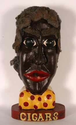 Bill & Phyllis Duffy. Cigar Trade Sign.: Carved and painted wood with steel wool hair. Signed and titled. Excellent condition. 12" x 8" x 24"h. Provenance: The George and Sue Viener Collection. Est. $800-1,200. Ship: $75