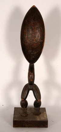 Ceremonial Spoon.: Carved wood. Chip on foot. 22.5" h x 6.5" x 6.5". Est. $100-200. Ship: $35. Artists in Dan communities of the Guinea coast have mastered the art of carving impressive large wood spoons known as wake m