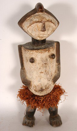 Bete Tribe Standing Female Figure.: Carved wood, paint, grass. Chipped right toes, otherwise good condition. 18.5 x 7" x 4". Est. $100-200. Ship: $35. Bete, standing female figure, Ivory Coast, wood and grasses. One of the features whic
